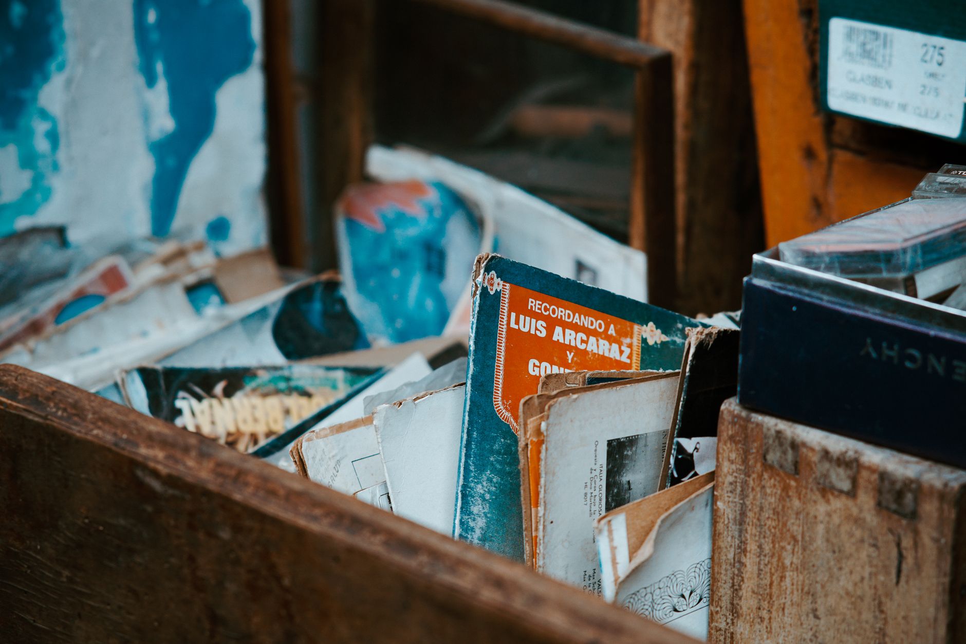 a dusty tablet sitting on a wooden crate