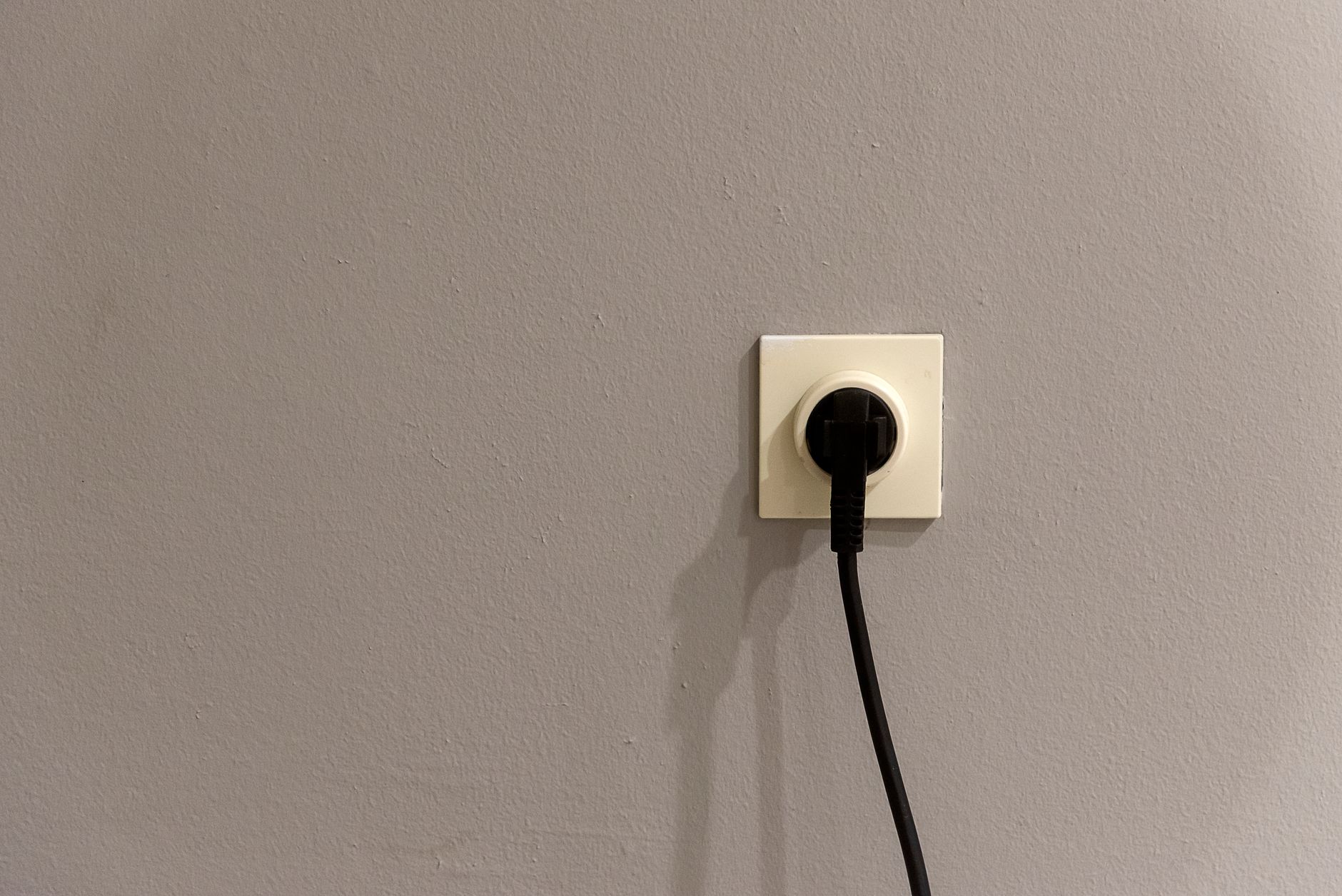 three giant blue power plugs entering a small map of Europe