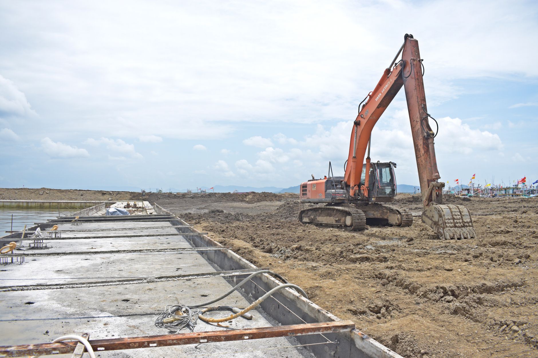 heavy machinery removing concrete stadium seating sections