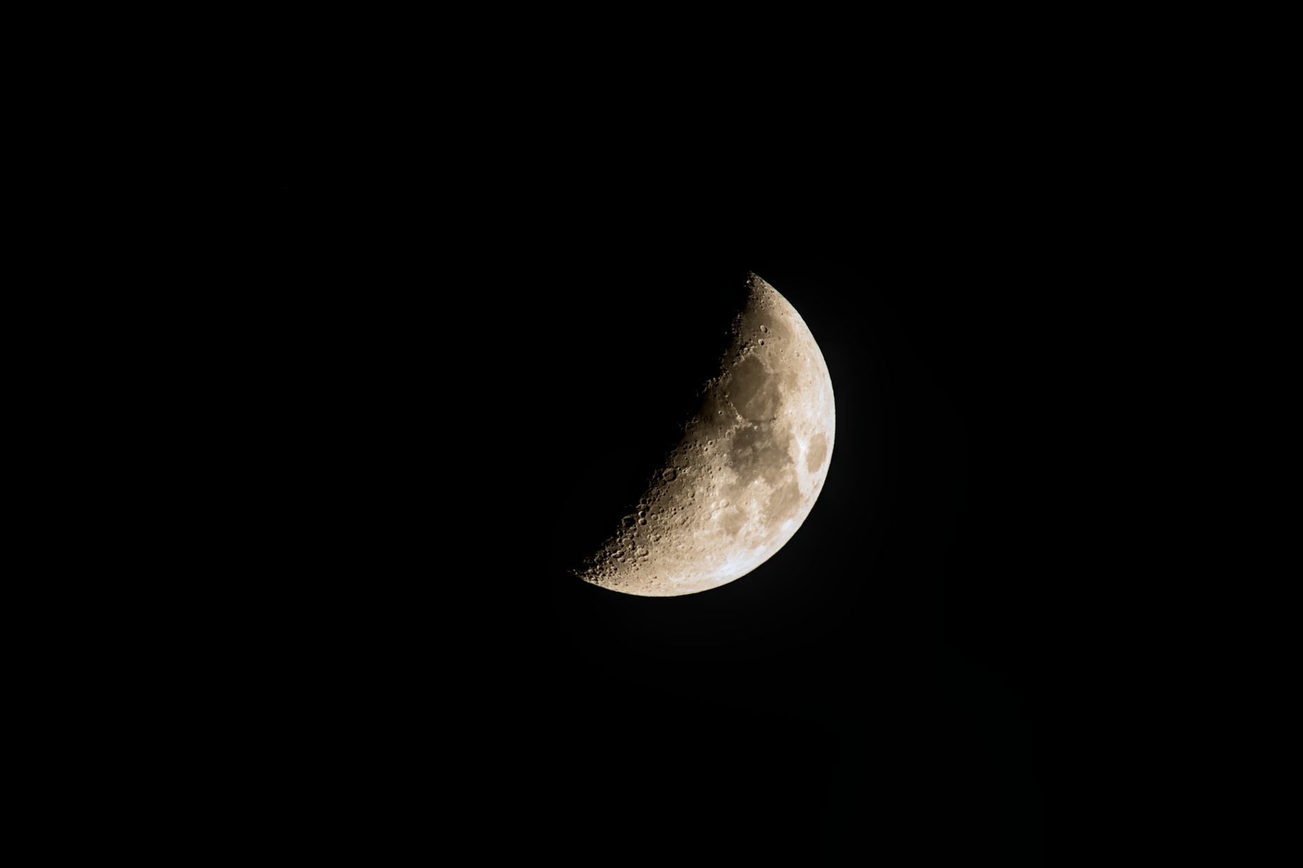 a single lonely satellite orbiting a jagged dark asteroid